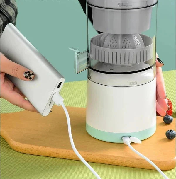 Belro portable wireless electric citrus juicer with orange slices and fresh juice in a kitchen setting