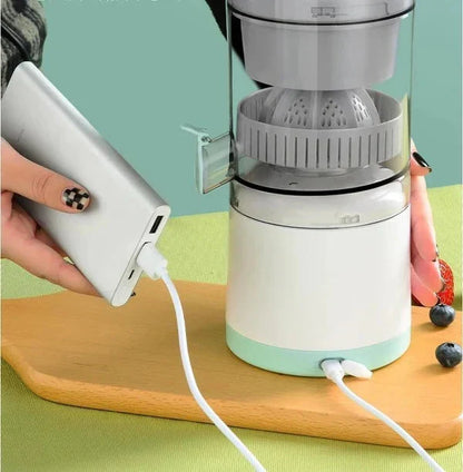 Belro portable wireless electric citrus juicer with orange slices and fresh juice in a kitchen setting