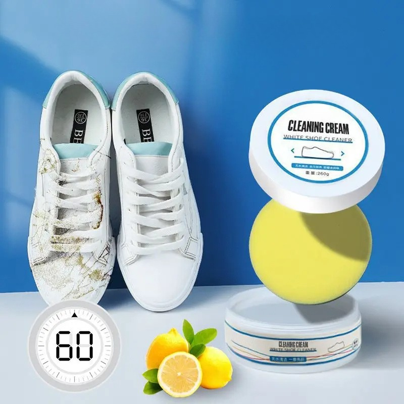 Belro 100g white shoes cleaner, all-purpose cleansing cream for men's footwear, shown in a container with shoes in the background.