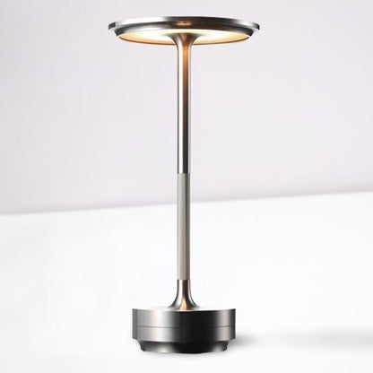 Silver Belro portable cordless desk lamp with adjustable light intensity, ideal for versatile lighting in workspaces.