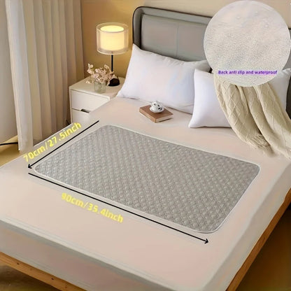 Gray washable incontinence bed protector by Belro, soft fabric with waterproof backing for bed protection and comfort.