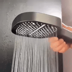 BowLift high-pressure shower head with Turbo Boost technology and water filtration, shown with water spray in a bathroom setting.