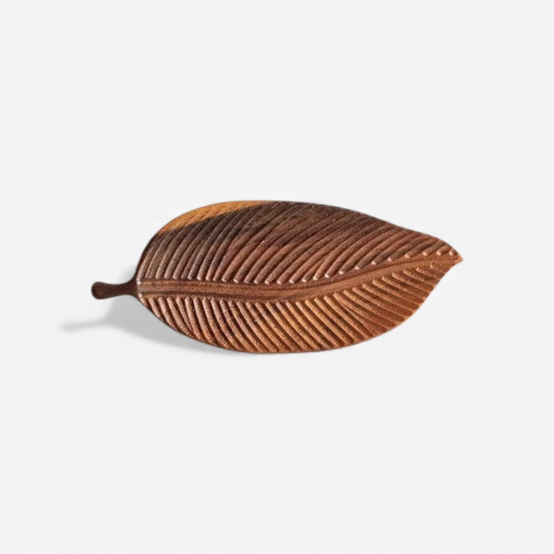 Wooden leaf serving tray with carved decorative design and handles, ideal for kitchen serving and dining by Mivoza.
