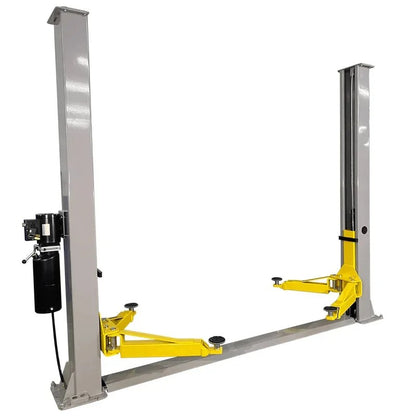 Casavibeo Triumph NT-9 9000 lb two-post car lift shown with its sturdy steel posts and lifting arms in a garage setting.