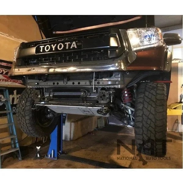 Casavibeo Triumph NT-9 9,000 lb two-post car lift with sturdy metal posts and safety arms, ideal for vehicle maintenance.