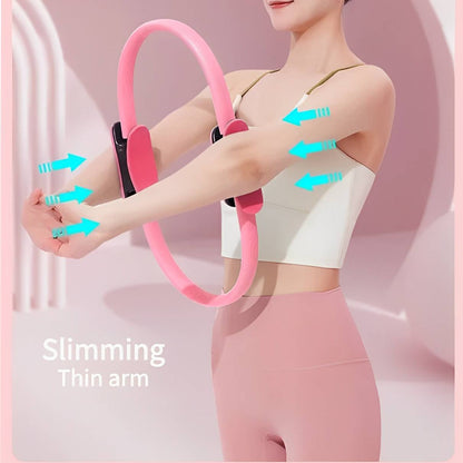 Men's Belro Pilates Ring used during workout, showing the flexible, circular exercise equipment for fitness training.