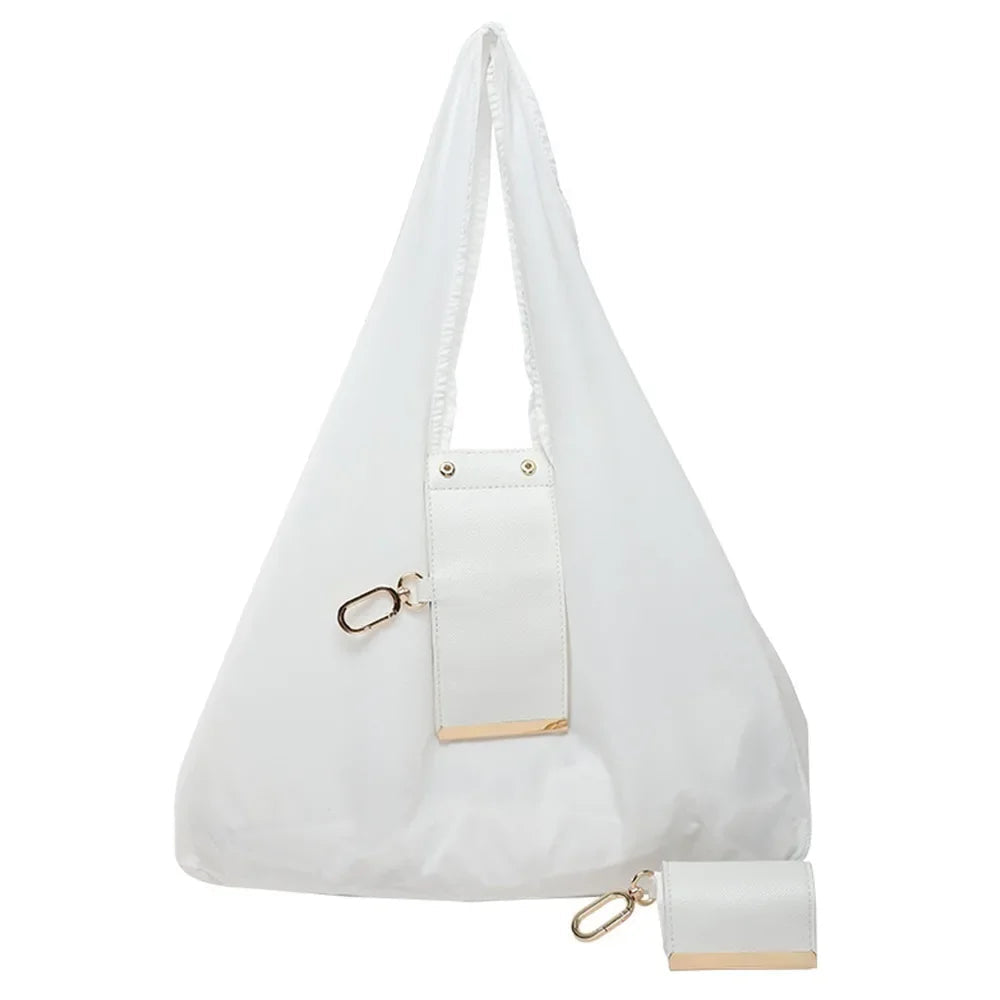 White Belro mini foldable tote bag keychain, compact accessory with wallet and card holder features, shown folded and open.