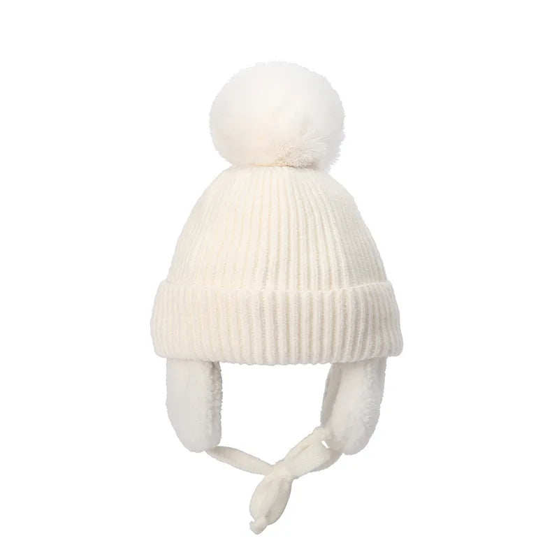 White kids knit beanie with earflaps, Belro winter hat for children, cozy and warm accessory for cold weather.