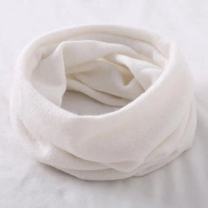 White thermal cashmere neck gaiter by Belro, designed for winter warmth and comfort, worn around the neck in a snug fit.
