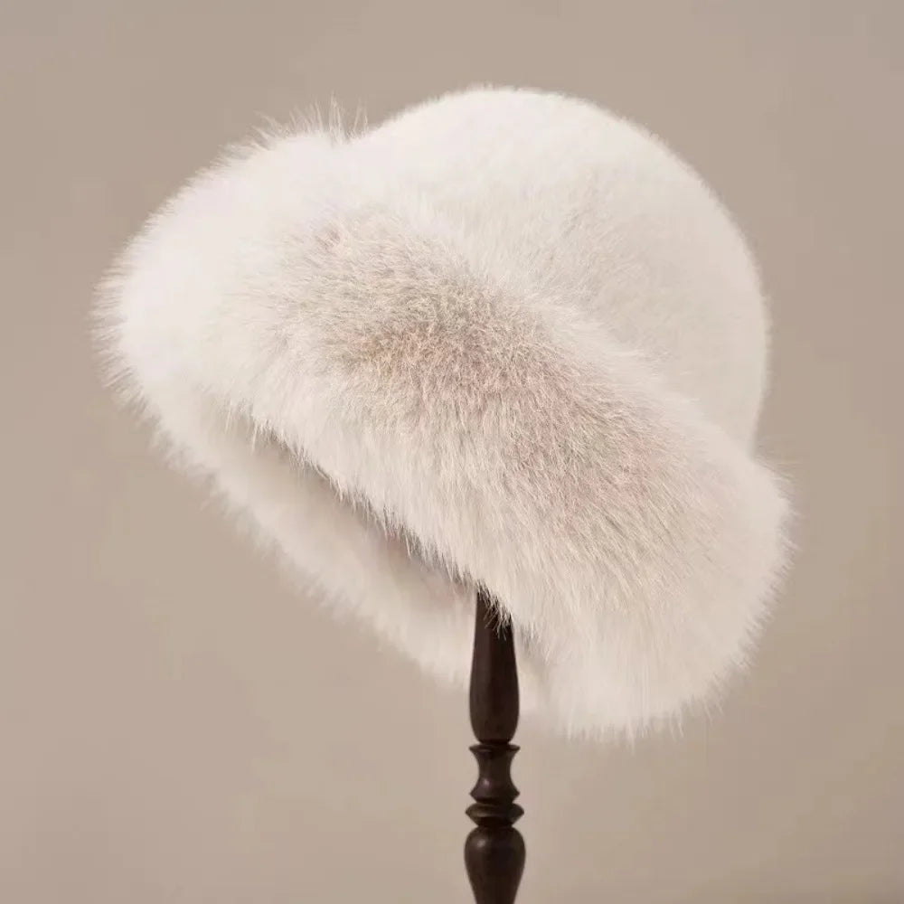 White women’s plush winter bucket hat by Belro, cozy and warm accessory with a soft, plush texture for cold weather.
