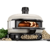 Casavibeo Gozney Dome pizza oven with white exterior and plant decoration, showcasing its outdoor cooking design.