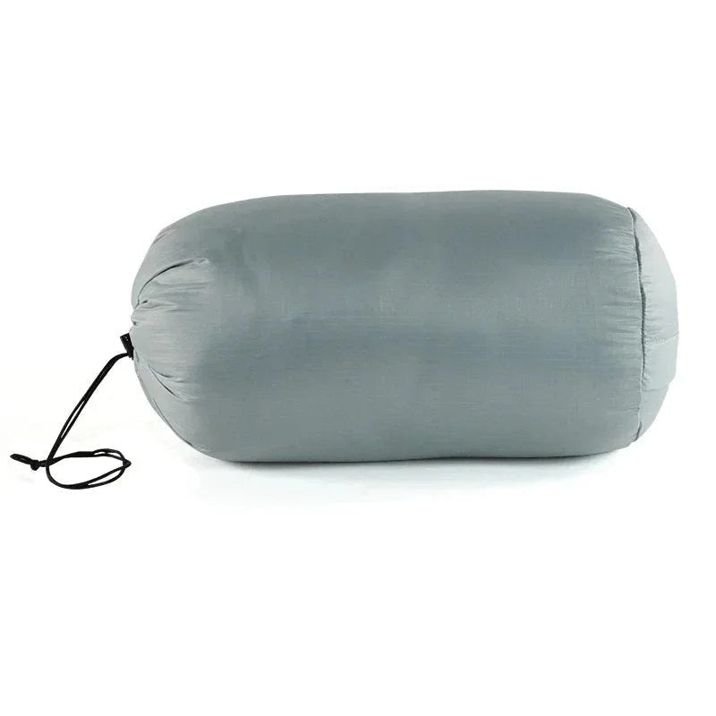 Casavibeo Wind River Outdoor Company Chilkoot sleeping bag shown in a camping setting, highlighting its insulated design and durable fabric.