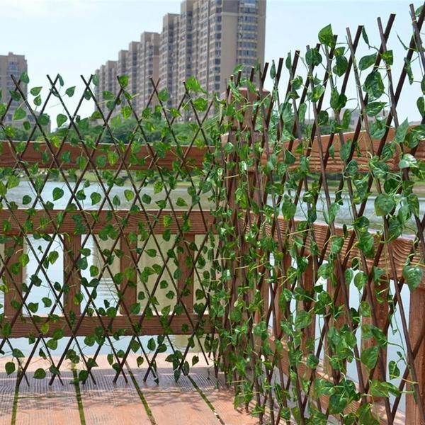 Artificial garden plant fence by Belro, retractable outdoor fencing for home garden decoration, with green foliage design.