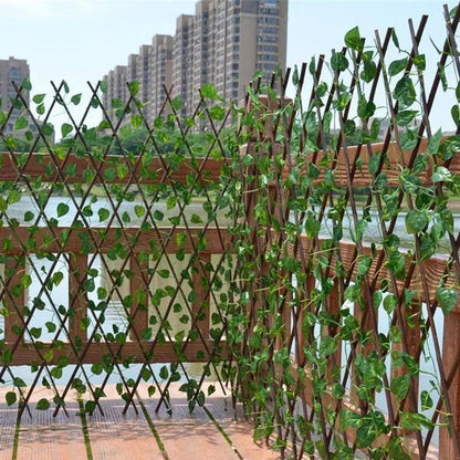 Artificial garden plant fence by Belro, retractable outdoor fencing for home garden decoration, with green foliage design.