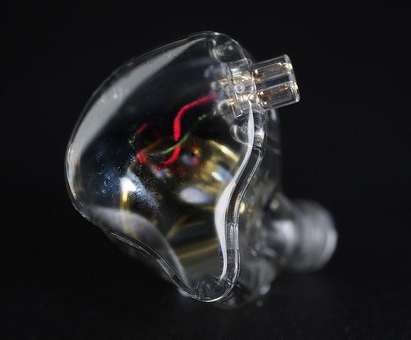 Belro in-ear monitors with sleek black design and silver accents, shown from a side angle highlighting earbud tips.