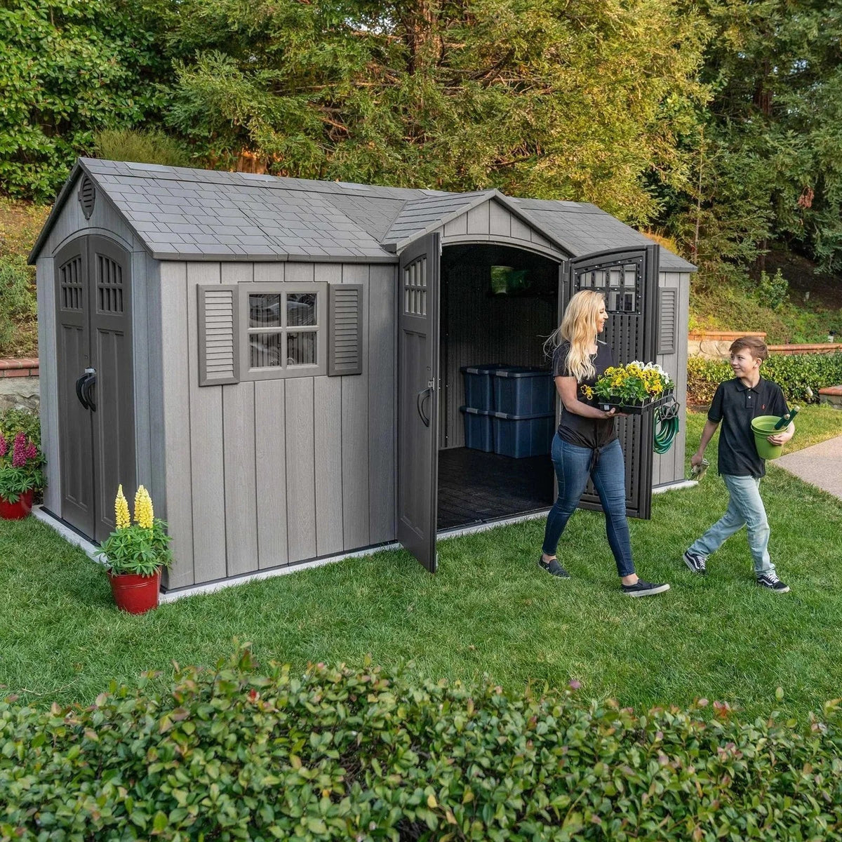Casavibeo Lifetime 15 ft x 8 ft outdoor storage shed with double doors and window, shown in a backyard setting.