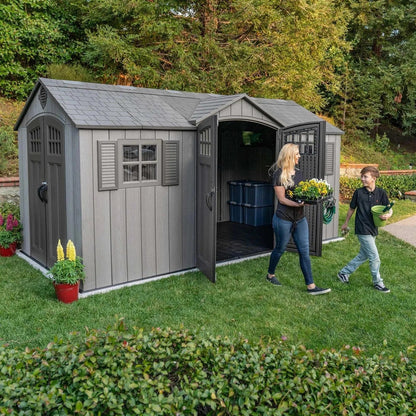 Casavibeo Lifetime 15 ft x 8 ft outdoor storage shed with double doors and window, shown in a backyard setting.
