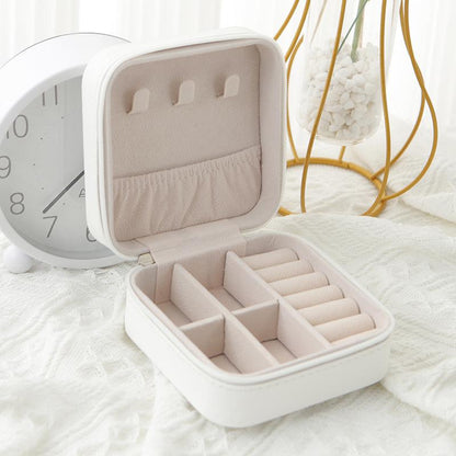 Belro travel jewelry case with compact design, featuring compartments for necklaces, rings, and earrings in soft, protective material