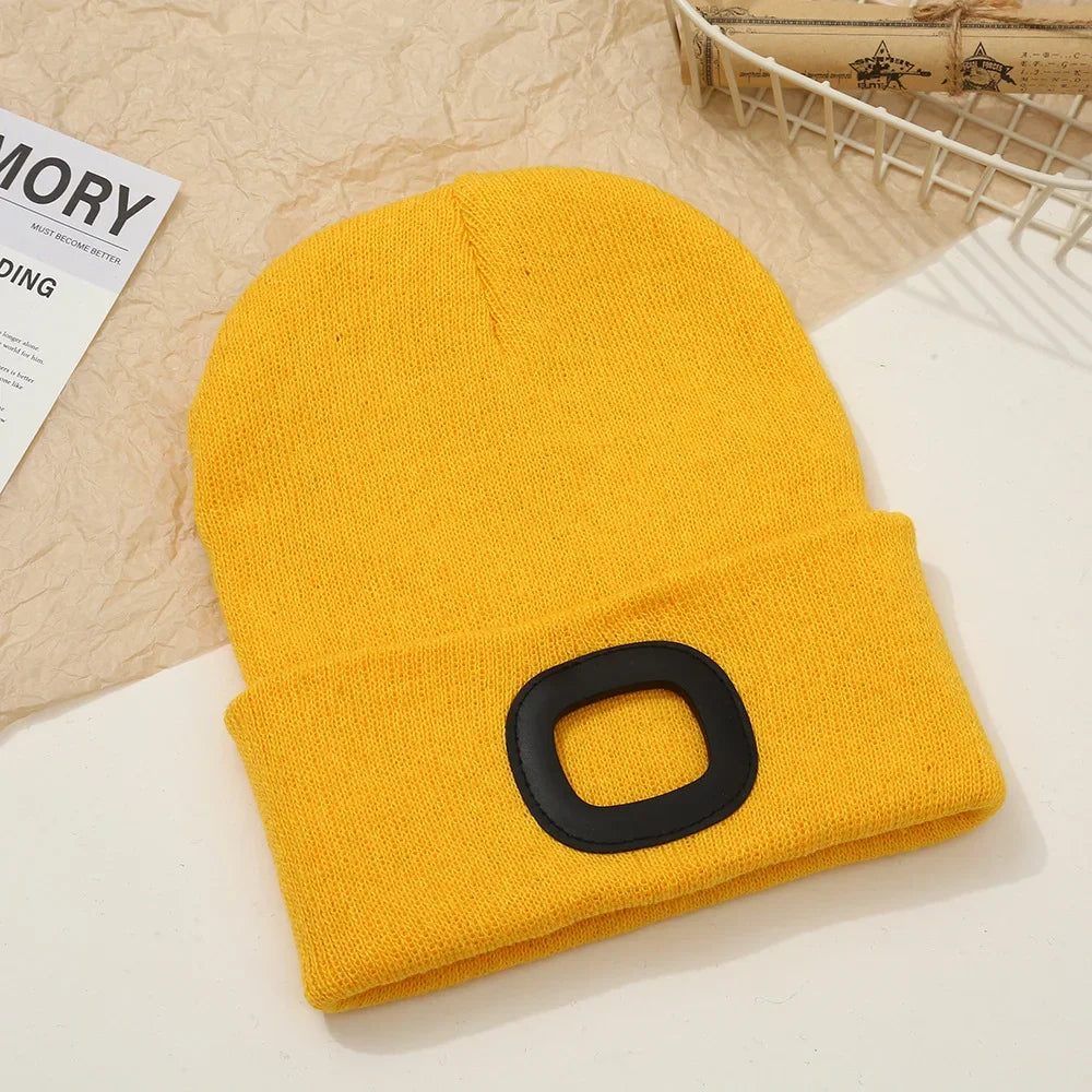 Yellow Belro rechargeable LED beanie hat with built-in light, ideal for winter outdoor activities and hands-free illumination.