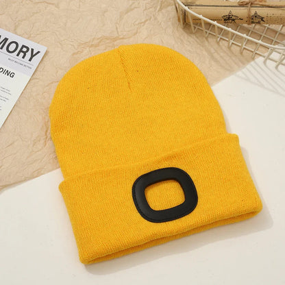 Yellow Belro rechargeable LED beanie hat with built-in light, ideal for winter outdoor activities and hands-free illumination.