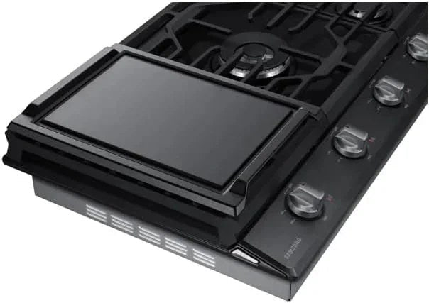 Samsung 36-inch gas cooktop with four burners and black finish, featuring control knobs and stainless steel surface.